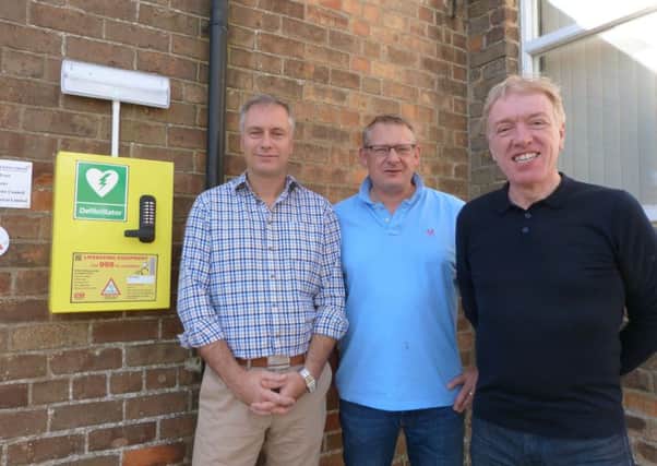 From left, Chairman of Rothwell Parish Council Rob Biglands, Parish Councillor Chris Miller and Parish Councillor Geoff Pearce outside the village hall. (Lin) EMN-160210-141111001