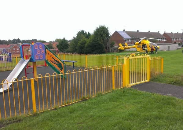 The air ambulance in George Street playing field. EMN-160926-110632001