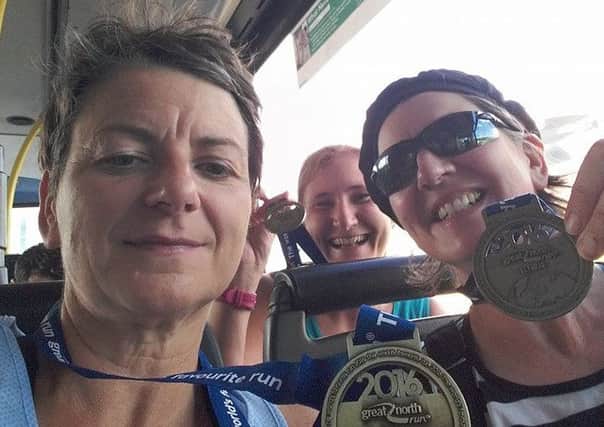 Pictured are Selina with her sister Kerry Horsman-Gray, showing off their Great North Run medals. fLXgxGaC1mmWrTBDfz7U