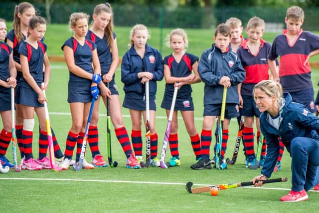 Crista Cullen coaches some St Hugh's hockey players. Photo: John Aron
