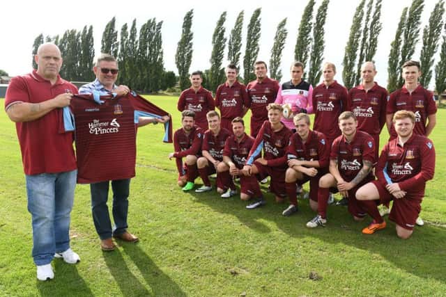 FC Hammers have taken stock of their new kit from sponspors the Hammer & Pincers. Pictured, from left, are club treasurer Chris Taylor with Hammer & Pincers landlord Wayne Salmon. The team are: back row (from left): Jacob Axtell, Chris Johnson, Diogo Garcia, Owen Taylor, Chris Brocklesby, Jamie Taylor, Liam Ingamells; front: Dan Avison, Joe Roberts, Craig Woodward, Joe Lote, Khristian Taylor, Reece Snade, Jace Snade.