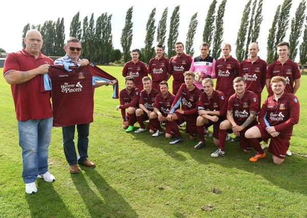 FC Hammers have taken stock of their new kit from sponspors the Hammer & Pincers. Pictured, from left, are club treasurer Chris Taylor with Hammer & Pincers landlord Wayne Salmon. The team are: back row (from left): Jacob Axtell, Chris Johnson, Diogo Garcia, Owen Taylor, Chris Brocklesby, Jamie Taylor, Liam Ingamells; front: Dan Avison, Joe Roberts, Craig Woodward, Joe Lote, Khristian Taylor, Reece Snade, Jace Snade.