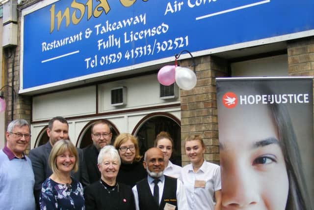 India Garden staff and Sleaford representatives of Hope For Justice. EMN-160310-181438001
