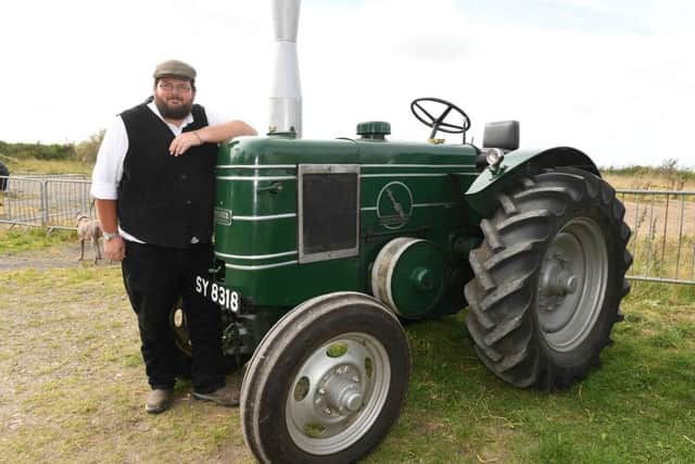 Heckington Windmill steam threshing event. Paul Cool of Sleaford with his 1945 Field Marshall tractor. EMN-160926-172157001