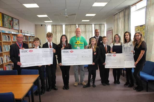 Cordeaux Academy pupils with representatives from the Air Ambulance and the British Heart Foundation.