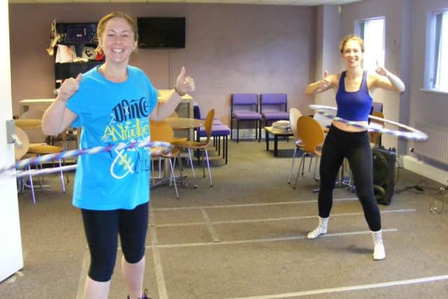 Go Dance teachers, from left - Jade Mountain and Harriet Spence get into the rhythm of their hula hooping marathon for Macmillan Cancer Care. EMN-160930-160629001
