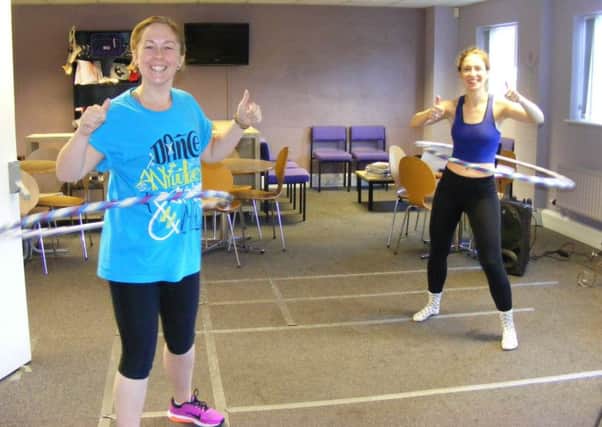 Go Dance teachers, from left - Jade Mountain and Harriet Spence get into the rhythm of their hula hooping marathon for Macmillan Cancer Care. EMN-160930-160629001
