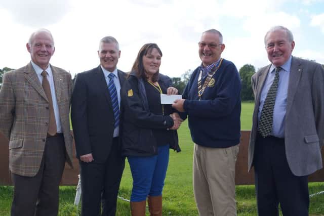 Rotarians have presented the money made from their successful golf day to the Lincs & Notts Air Ambulance EMN-160410-151335001