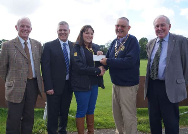 Rotarians have presented the money made from their successful golf day to the Lincs & Notts Air Ambulance EMN-160410-151335001