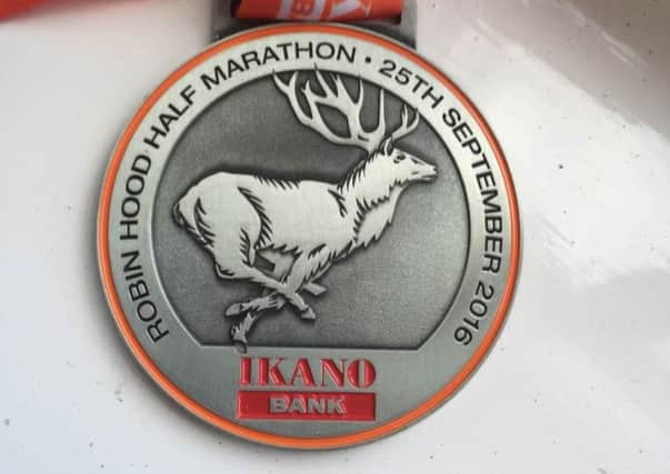 Robin Hood half marathon finisher's medal. lEaAwTWVrNsmRqOzMgbZ