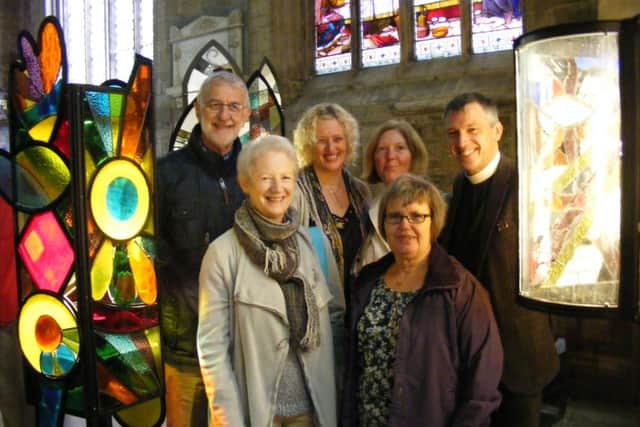 Members of the Glassumimass glass project unveil the finished lanterns with Rev Philip Johnson at St Deny's Church, Sleaford. Pictured with him are: David and Gillian Wing of Strawberry Glass of Spalding, Marion Sander of ArtsNK, Margot Charlton and Ann Hughes. EMN-161010-110236001