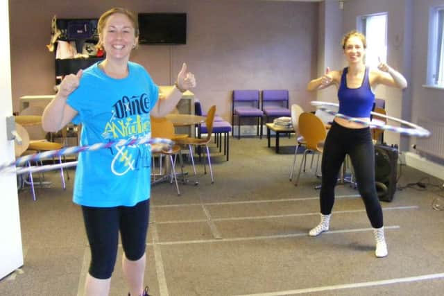 Go Dance teachers, from left - Jade Mountain and Harriet Spence get into the rhythm of their hula hooping marathon for Macmillan Cancer Care.
