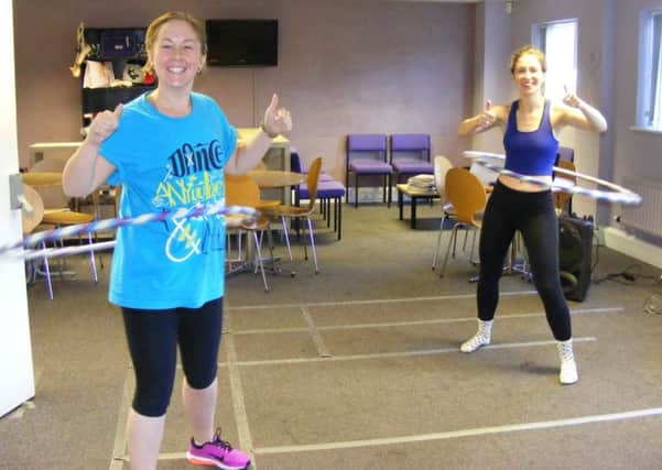 Go Dance teachers, from left - Jade Mountain and Harriet Spence get into the rhythm of their hula hooping marathon for Macmillan Cancer Care.