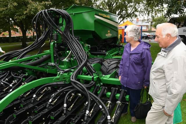 Made in Sleaford event at NCCD. Norman and Sue Robinson of Ruskington looking at Great Pains seed sowing machine. EMN-161010-102817001