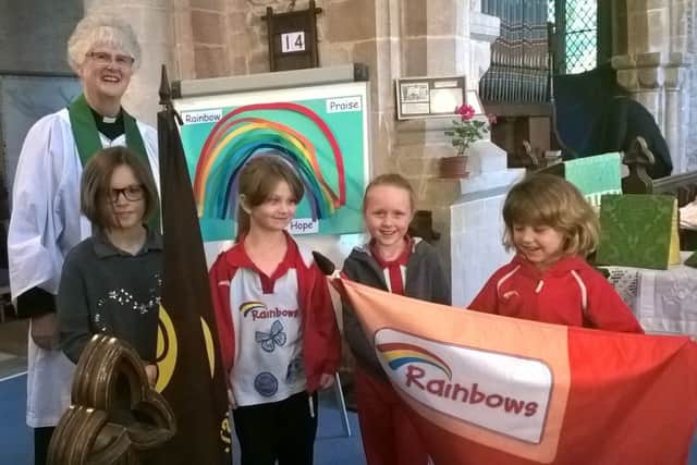 Girls from 1st Rainbows and Brownies attended a service at St Mary's Church with Rev Valerie Rampton EMN-160610-140000001