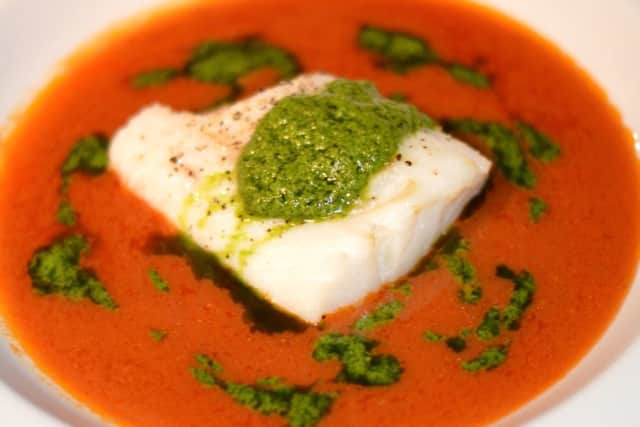 Cod in tomato bisque with spinach pesto