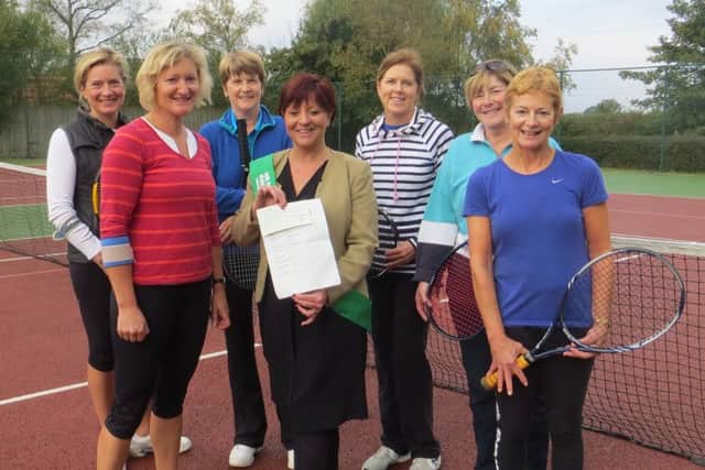 Tanya Taylor from Macmillan Cancer Support with some of the Tealby members who supported the charity play day. EMN-161014-191315001