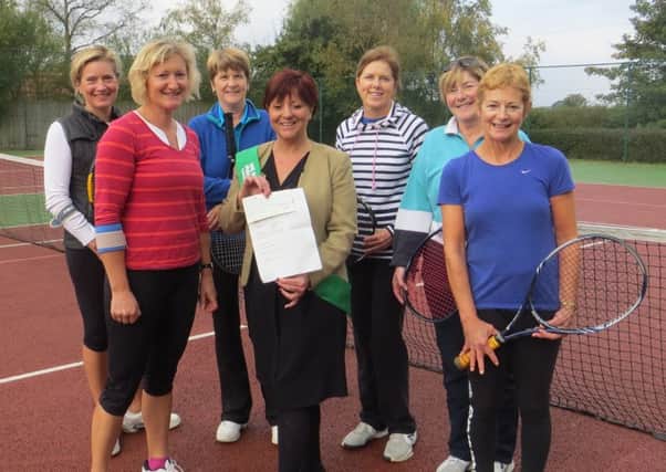 Tanya Taylor from Macmillan Cancer Support with some of the Tealby members who supported the charity play day. EMN-161014-191315001