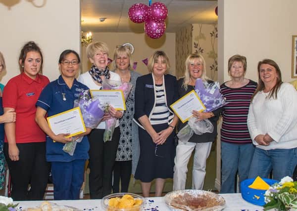 Staff at Doulton Court Care Home in Sutton on Sea celebrating the homes 30th anniversary and a number of long service awards.