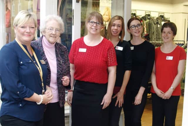 Pictured celebrating 20 years is (L-R): Store manager, Ann-Marie Smith, Councillor Margaret Ottaway who officially opened the store 20 years ago, supervisor Margaret Brocklebank and supervisor Emily Jaines with sales advisors Amy Lucas and Caroline Bell.