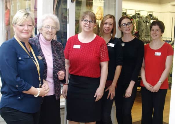 Pictured celebrating 20 years is (L-R): Store manager, Ann-Marie Smith, Councillor Margaret Ottaway who officially opened the store 20 years ago, supervisor Margaret Brocklebank and supervisor Emily Jaines with sales advisors Amy Lucas and Caroline Bell.