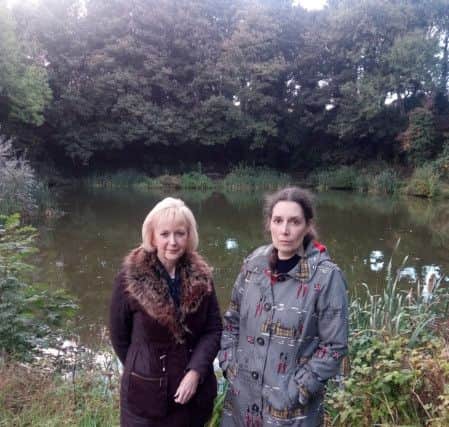 Jo Sheldon (left) with neighbour Jenny Dunbar at the Charles Street pond.