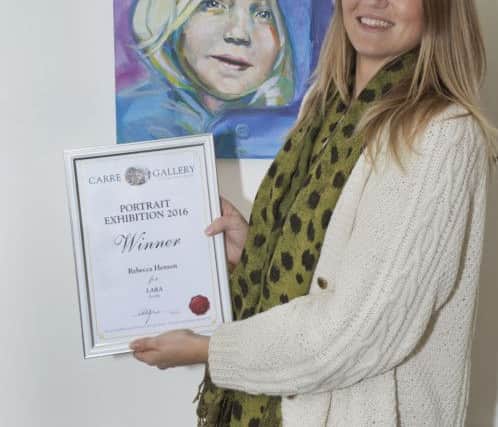 Winner of the Carre Gallery Portrait Competition 2016, Rebecca Henson with her painting 'Lara' Copyright Martin Cameron EMN-161013-094605001
