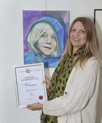 Winner of the Carre Gallery Portrait Competition 2016, Rebecca Henson with her painting 'Lara' Copyright Martin Cameron EMN-161013-094605001