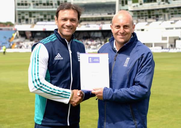 Adam Grist receives his Outstanding Contribution regional award from England batting coach mark Ramprakash during the Headingley Test match EMN-161014-115240002