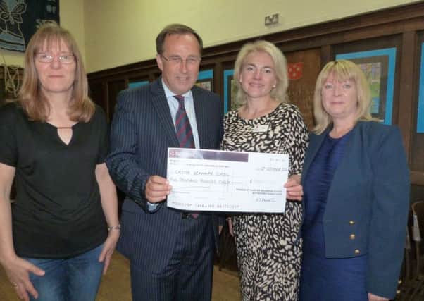 Tracey Edwards, Chair of CGS PTAssociation handing a cheque for ?5,000 to head master Roger Hale. Also pictured are treasurer Alison Hannath and vice-chair Sharon Ferguson. EMN-161025-095406001