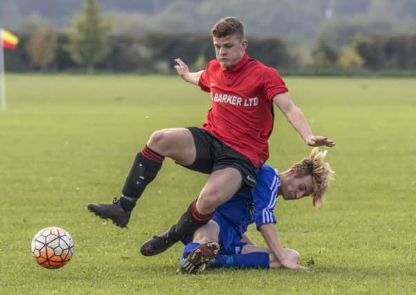 Coningsby Reserves Brendan Rylett has a soft landing during Saturdays game. Photo: Oscarpix Imaging