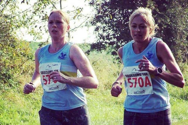 Janine Stones and Sheryl Hawse were the first ladies team back at the Gruesome Twosome 10k EMN-161017-125631002