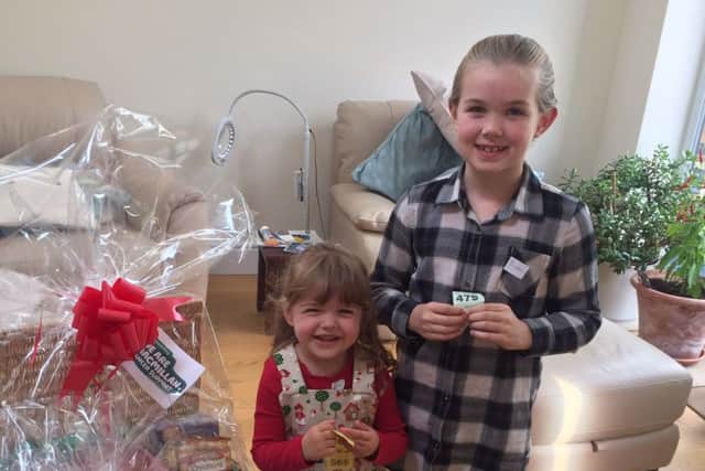 Pictured are youngsters Georgie and Pheobe drew the raffle on the day.