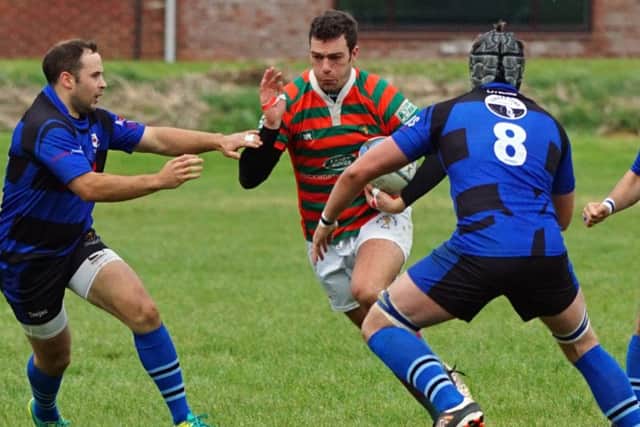 Paul Gee goes for a gap in the Glossop defence EMN-161017-170342002