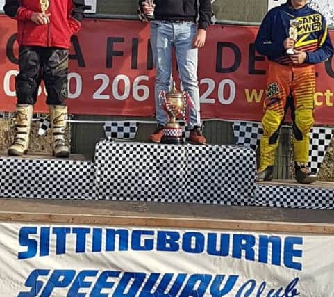 On the podium: Jack Bell in top spot after winning all his races in his grass track debut in Kent.