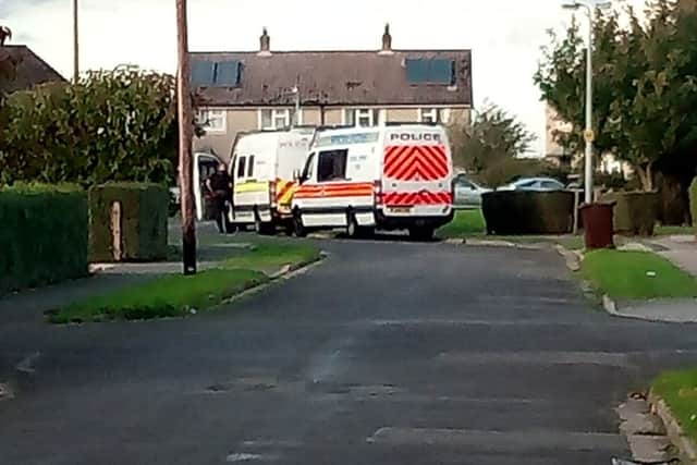 Police operational support vans and a dog unit attend an address on Princess Square in Billinghay this afternoon (Friday).