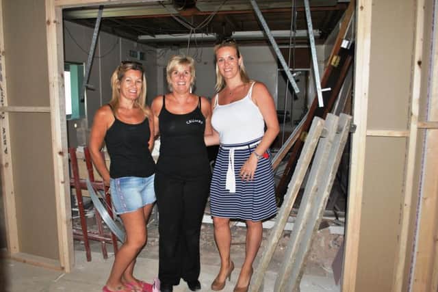 Debbie Watts (left) and Carol Rate, of Crumbs cafe, with Waterfall Plaza joint owner Amy Wilkinson. Debbie and Carol are planning to open a new associated business in this unit currently undergoing refurbishment. It will serve takeaway and eat-in meals, with access to the open-air courtyard area for fair-weather diners.