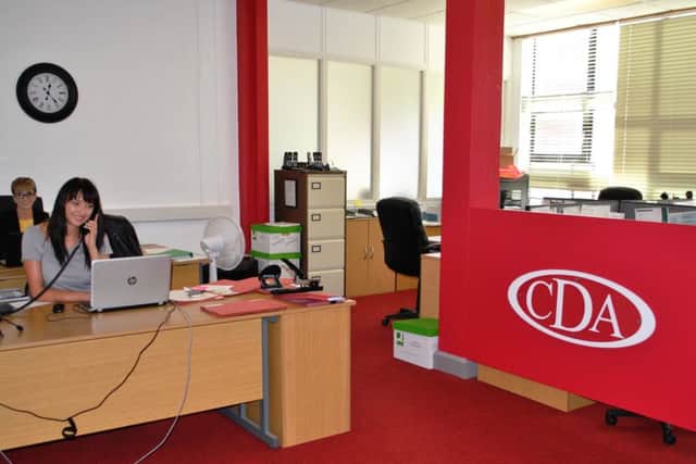 Criminal Defence Associates  have settled into their new office at County Hall. Pictured are legal representatives Amie Maddison and Karolina Buczek (on the phone).