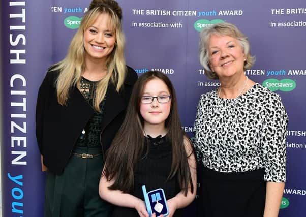 Keira Beeson, 11, with Kimberly Wyatt and Dame Mary Perkins. EMN-161019-172616001