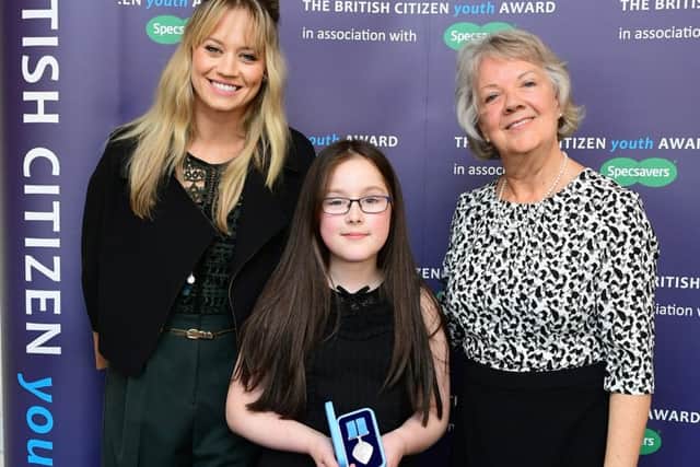 Keira Beeson, 11, with Kimberly Wyatt and Dame Mary Perkins. EMN-161019-172616001