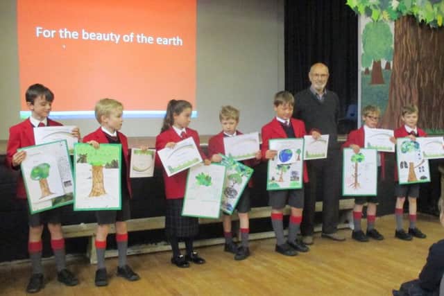 Pupils at St Hugh's School in Woodhall Spa receiving Certificates from Tim Curtis of the Woodhall Spa Tree Group. EMN-161025-070605001