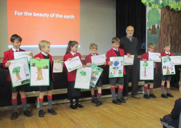 Pupils at St Hugh's School in Woodhall Spa receiving Certificates from Tim Curtis of the Woodhall Spa Tree Group. EMN-161025-070605001