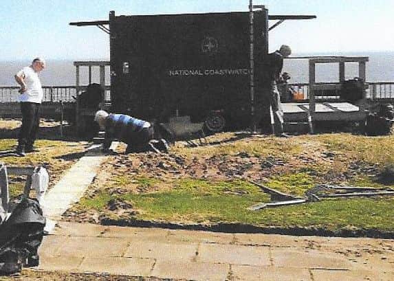 Coastwatch volunteers laying path at temporary watchstation trailer. ANL-161027-152252001