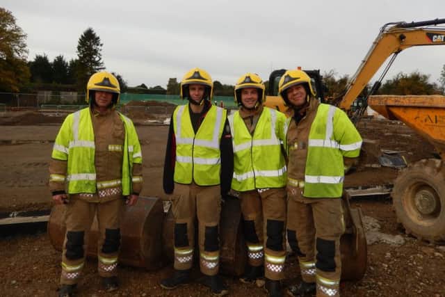 Inspecting the new fire station building site. From left - Ff Mark Aspinall, Ff Marc Gardener, DCM Chris Lowe and Ff Bob Machin EMN-161031-195641001