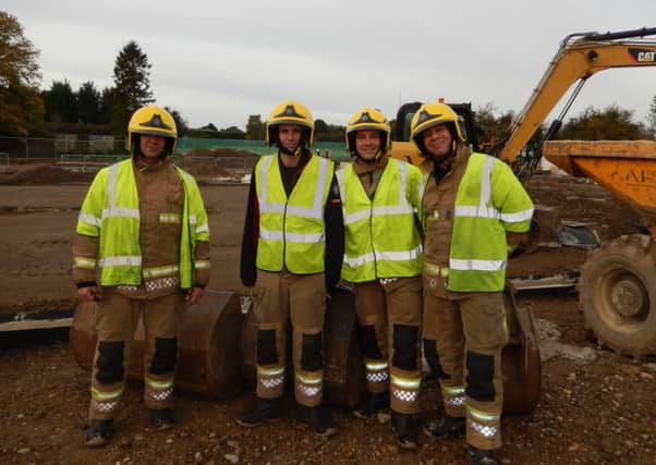 Inspecting the new fire station building site. From left - Ff Mark Aspinall, Ff Marc Gardener, DCM Chris Lowe and Ff Bob Machin EMN-161031-195641001