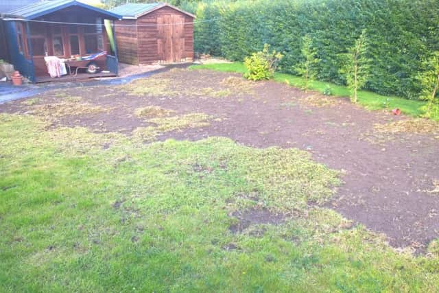 A damaged garden in Horncastle EMN-161024-131320001