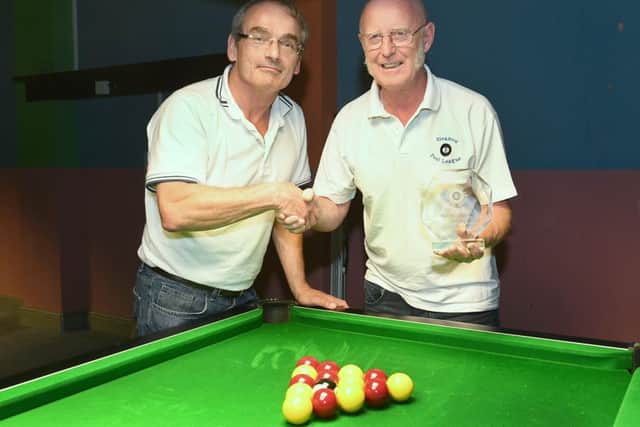 Sleaford and District Pool League presentations. L-R Chairman Paul Whitaker presenting a gift to Andy Brett who is retiring as treasurer. Photo: David Dawson