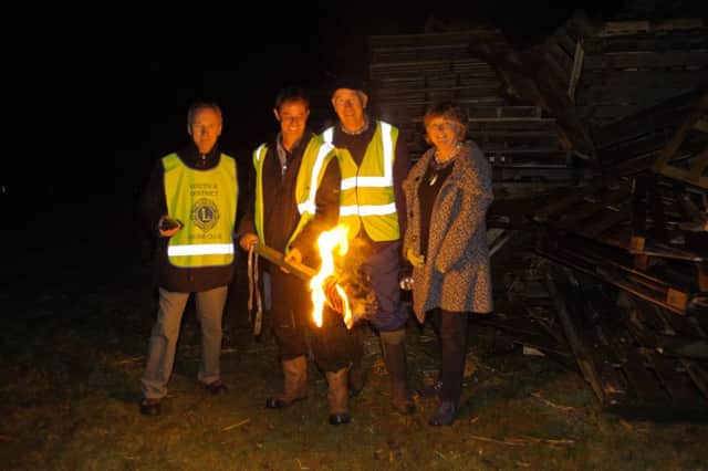 Deighton Close, Louth - Charity Bonfire. Lighting the fire is Mike Armstrong, Daniel McNally - Chairman, Robert Haynes - Rotary President, Mayor Jill Makinson-Sanders. Photo: Aidan Clarkson. EMN-161027-123530001