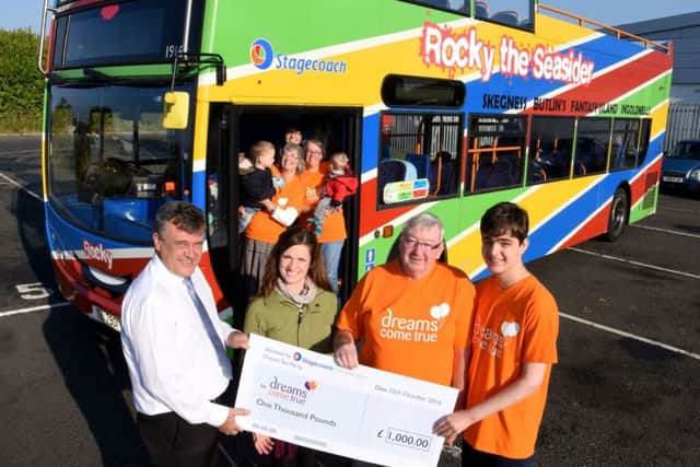 Stagecoach East Midlands making its £1,000 donation to Dreams Come True. Ian Naylor (operations manager at Skegness), Roanna Scott (marketing assistant), John and Sebastian (Dreams Come True family) standing in front of Rocky the Seasider.