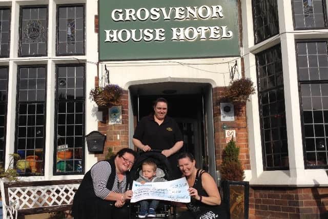 A cheque for ?1,200 for Harrison Thompson (centre) has been presented following a Zumbathon at the Grosvenor House Hotel in Skegness. ANL-160411-111201001